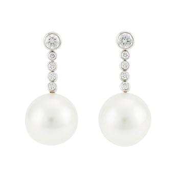 576. A pair of Tiffany & Co  platinum earrings with cultured pearls and round brilliant-cut diamonds.