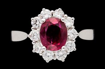 700. A gold, ruby and diamond ring.