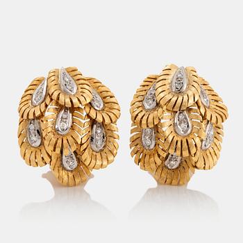 891. A pair of 18K gold earrings set with eight-cut diamonds.