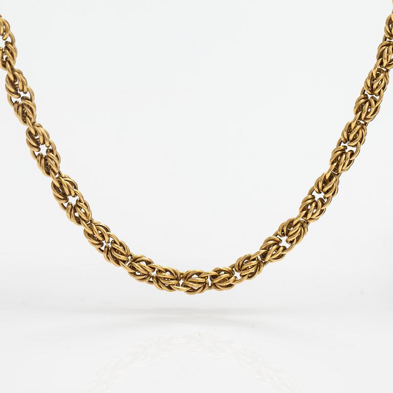 An 18K gold necklace. Unoaerre, Italy.