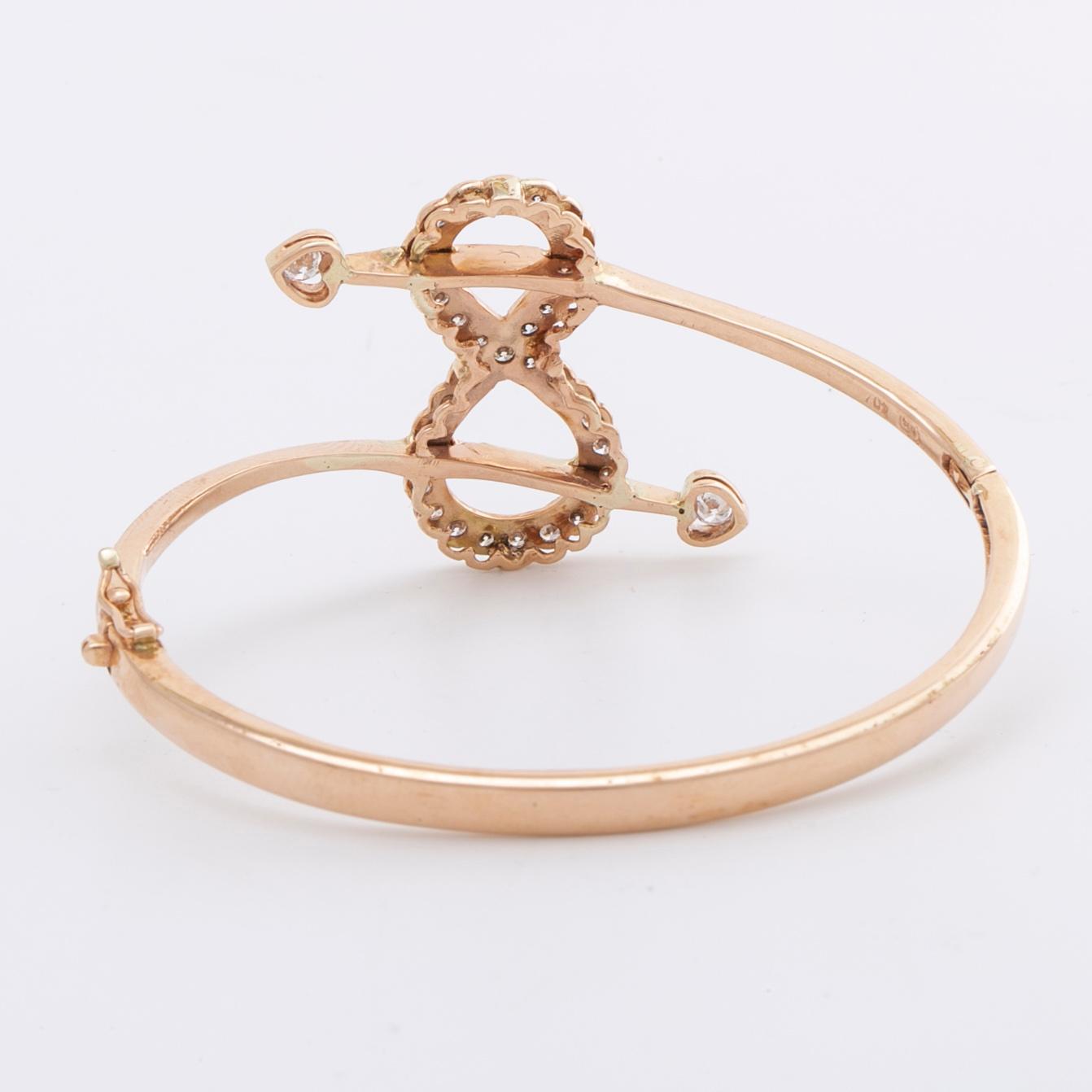 ARMRING 14K guld m briljanter ca 1,3 ct totalt, öppningsbar.