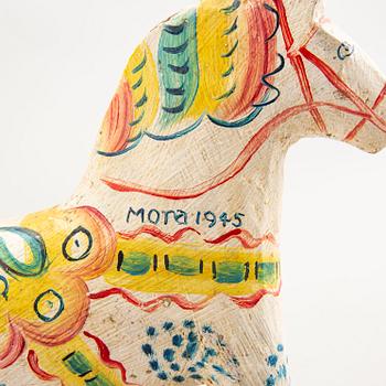 A Swedish painted and dated 1945 wooden horse.