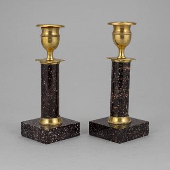 A pair of late gustavian porphyry candle sticks early 19th century.