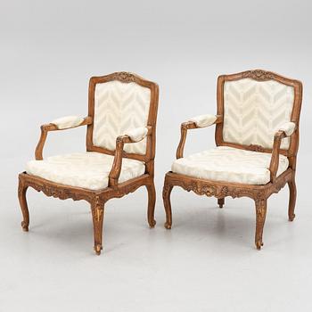 A pair of French Louis XV fauteuils, mid 18th century.
