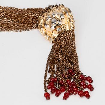 CHANEL, a gold colored metal necklace.