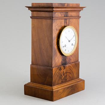 A French Empire mahogany mantle clock by Alexandre à Paris, first half of the 19th Century.
