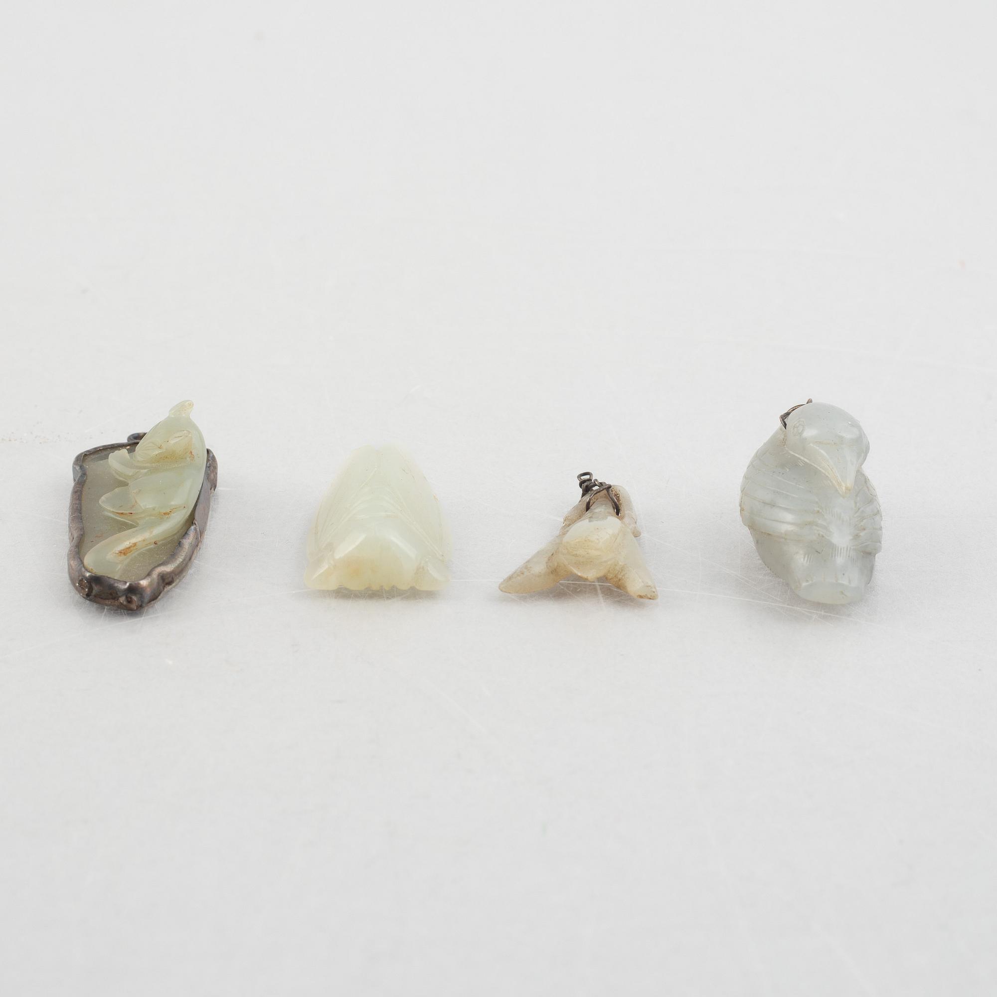 A group of eight Chinese stone charms / pendants, 20th century.
