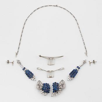 A diamond and sapphire set, probably Garrard & co. The set can be worn as a necklace, earrings, double clip or brooch.