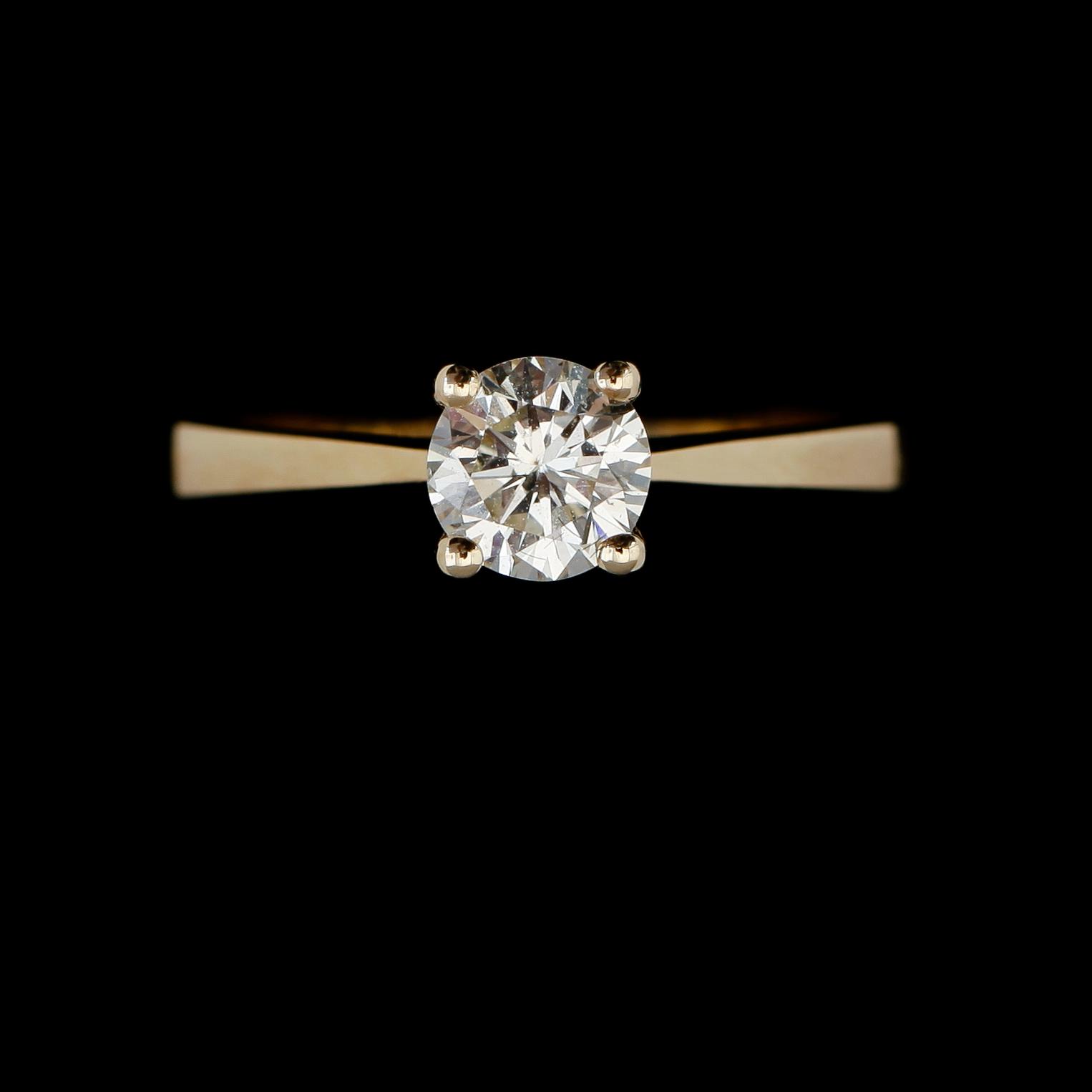 RING, 14K guld, solitär briljantslipad diamant ca 0.73 ct.