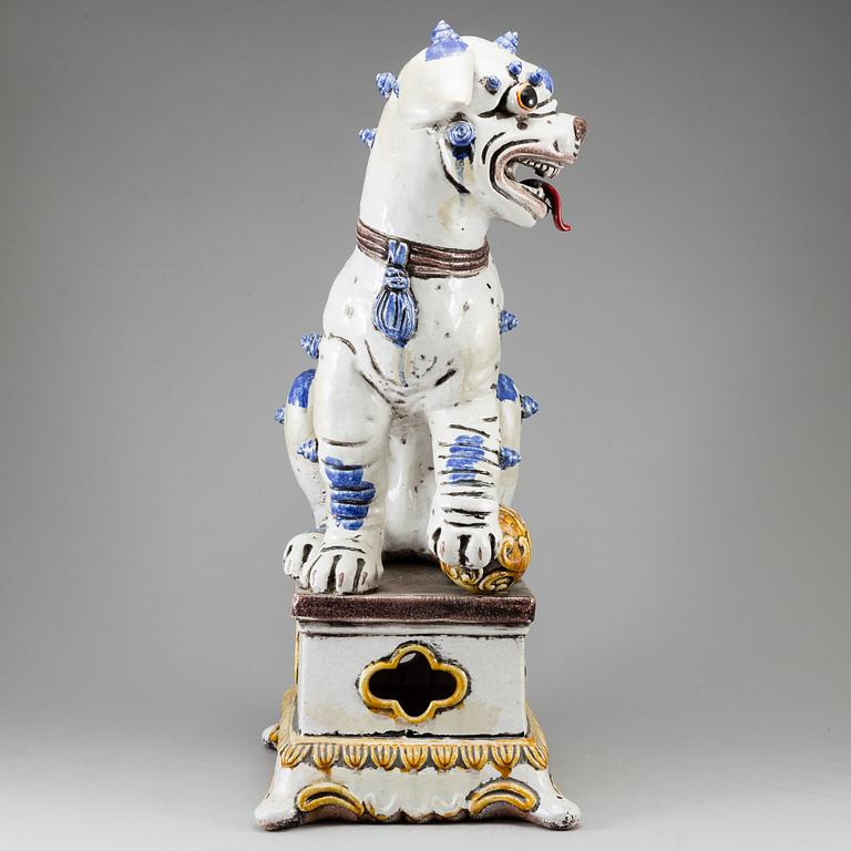 A large Chinese ceramic tile sculpture of a buddhist lion, 20th century.