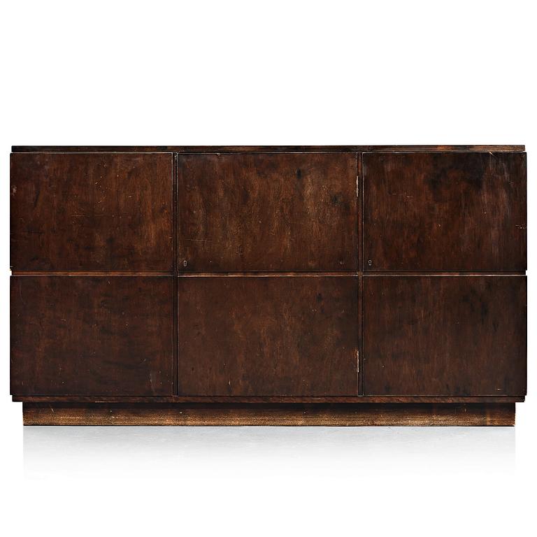 Axel Einar Hjorth, a darkly stained birch sideboard,"Typenko", Nordiska Kompaniet, Sweden 1932.
