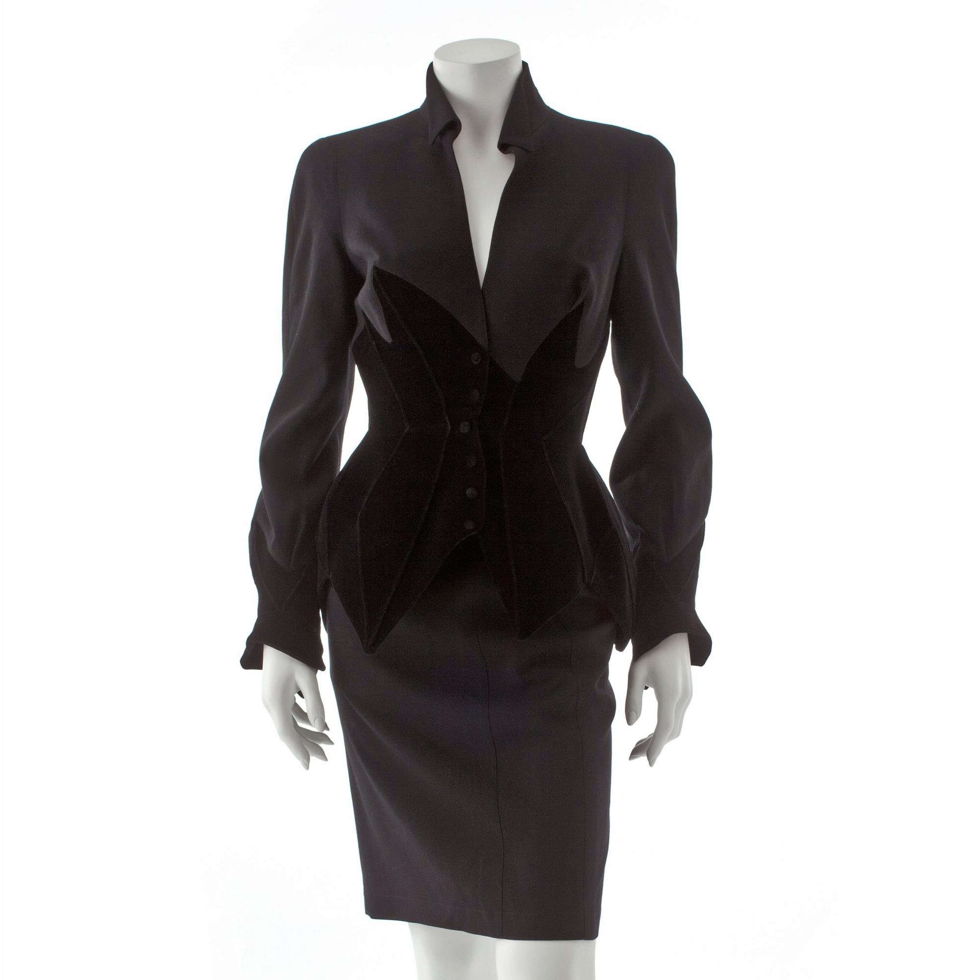 THIERRY MUGLER, a two-piece black wool and velvet dress consisting of jacket and skirt.