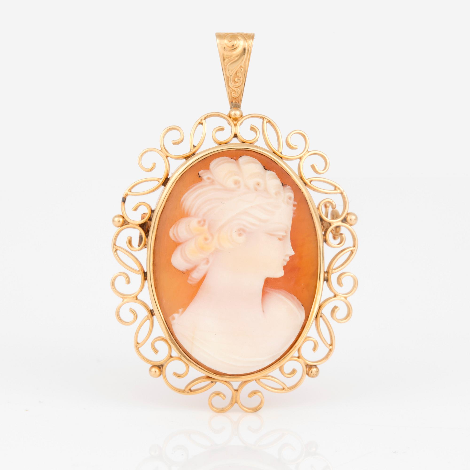 HÄNGE/BROSCH, 18K guld med snäckskalcamé, Stockholm 1948. Total vikt 8,73 g.