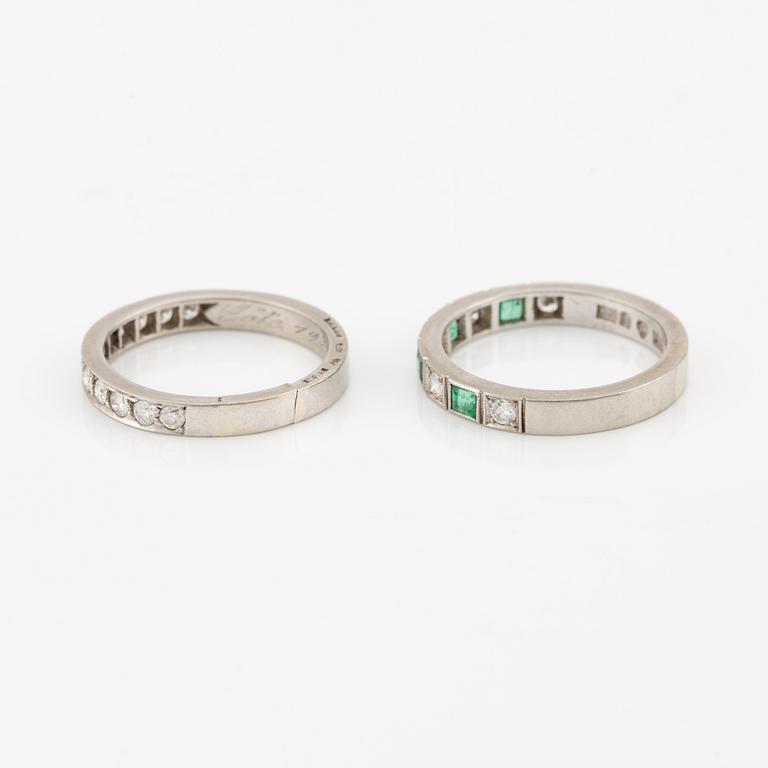 Rings, 2 pcs, alliance rings, 18K white gold with diamonds, one of them with diamonds and emeralds.