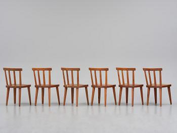 Axel Einar Hjorth, a set of six stained pine "Utö" chairs, Nordiska Kompaniet, Sweden, 1930s.