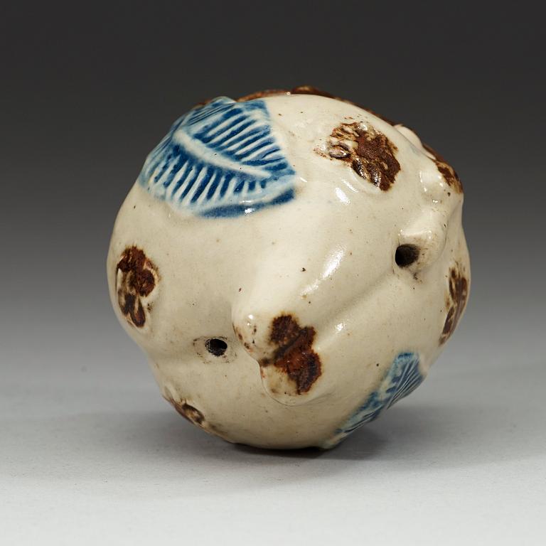 A stoneware peach-form water dropper, Choson period, 18th century. Korea.