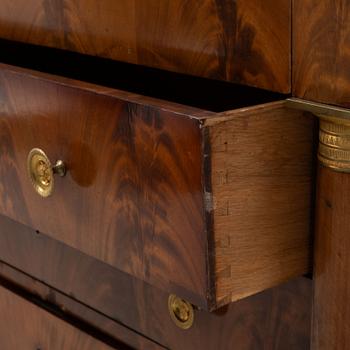 A French Empire mahogany and gilt brass mounted commode, early 19th century.