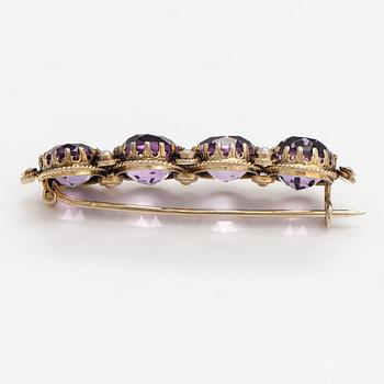 A necklace, bracelet and two brooches in gilded silver and with amethysts and pearls.