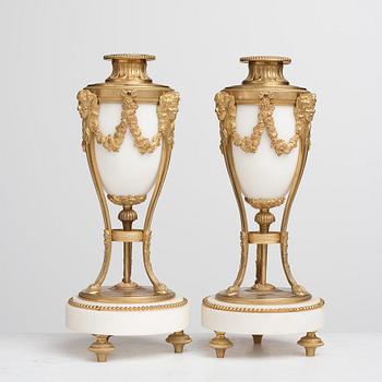 A pair of Louis XVI-style candlesticks, circa 1900.