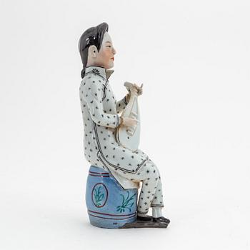 A Chinese porcelain figure, 20th century.