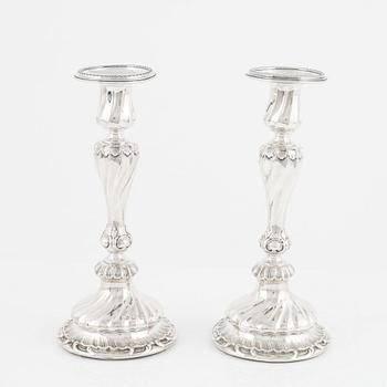 A pair of silver candle sticks by K Anderson Stockholm 1898.