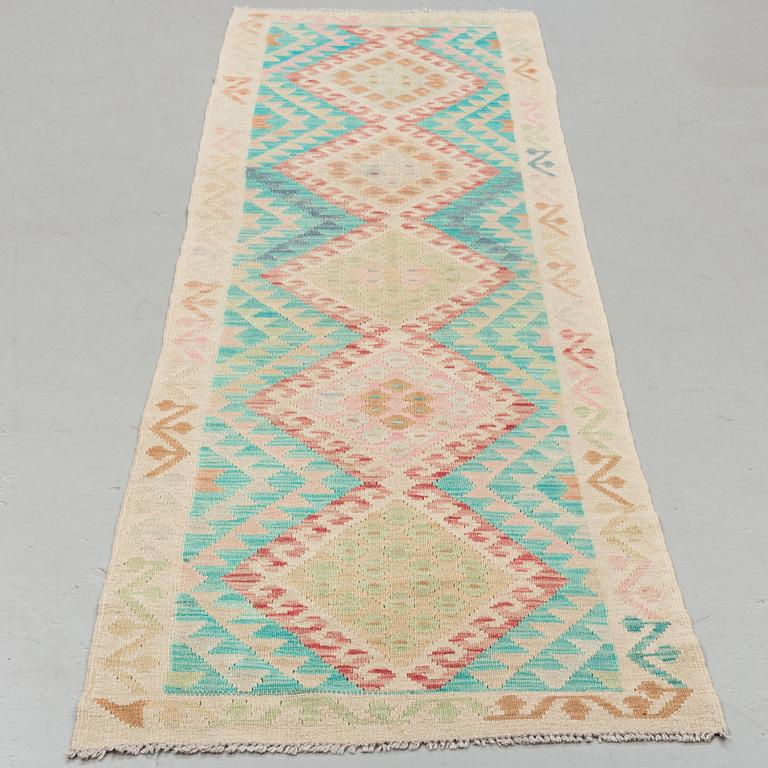 A kilim runner, around ca 290 x 72 cm.