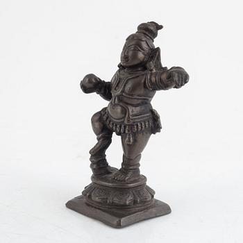 A small bronze figure of Krishna, Southern India, 16th/ 17th century.