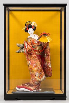 Four late 20th century Japanese dolls.