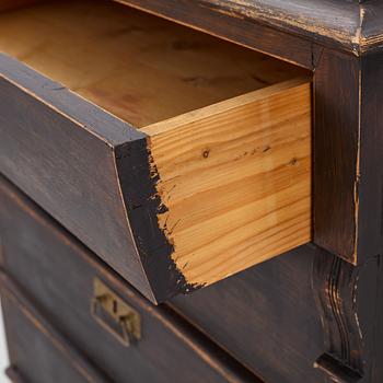 A chest of drawers, circa 1900.