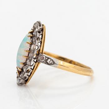 A ca. 18K gold ring with an opal and rose-cut diamonds.