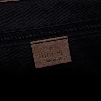 GUCCI, a pink monogram canvas handbag.