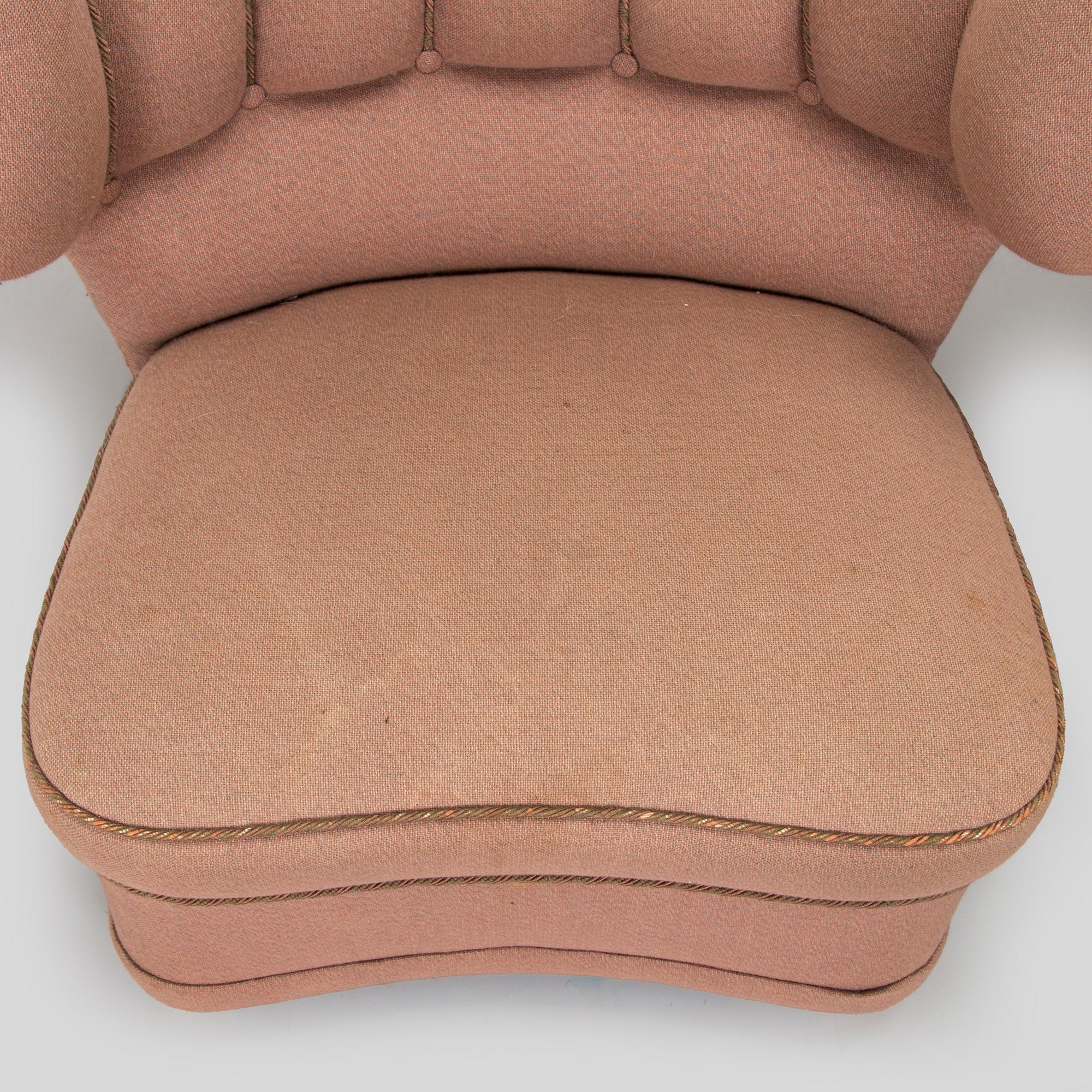 A pair of mid-20th century armchairs.