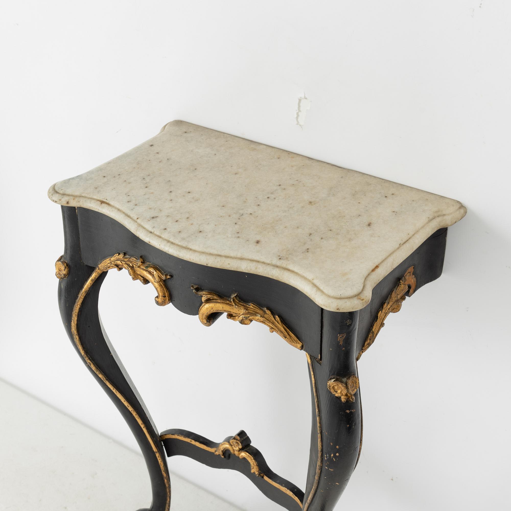 A Rococo revival mirror and a console table, second half of the 20th Century.