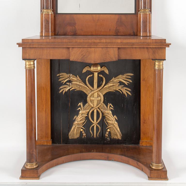 A swedish empire mirror and console table. First half of the 19th century.