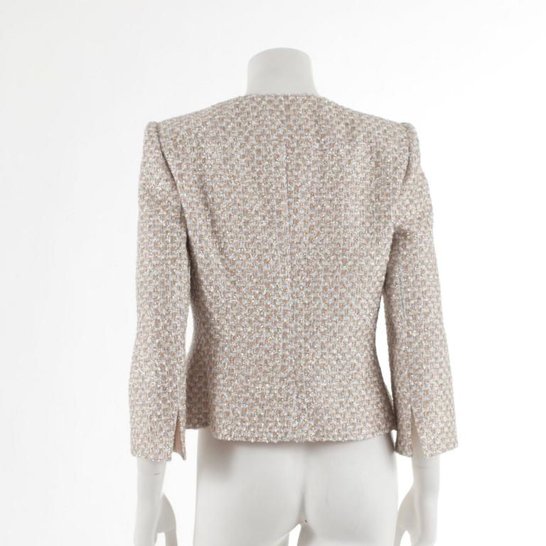 ARMANI, a silver and gold colored evening jacket. Italian size 44.