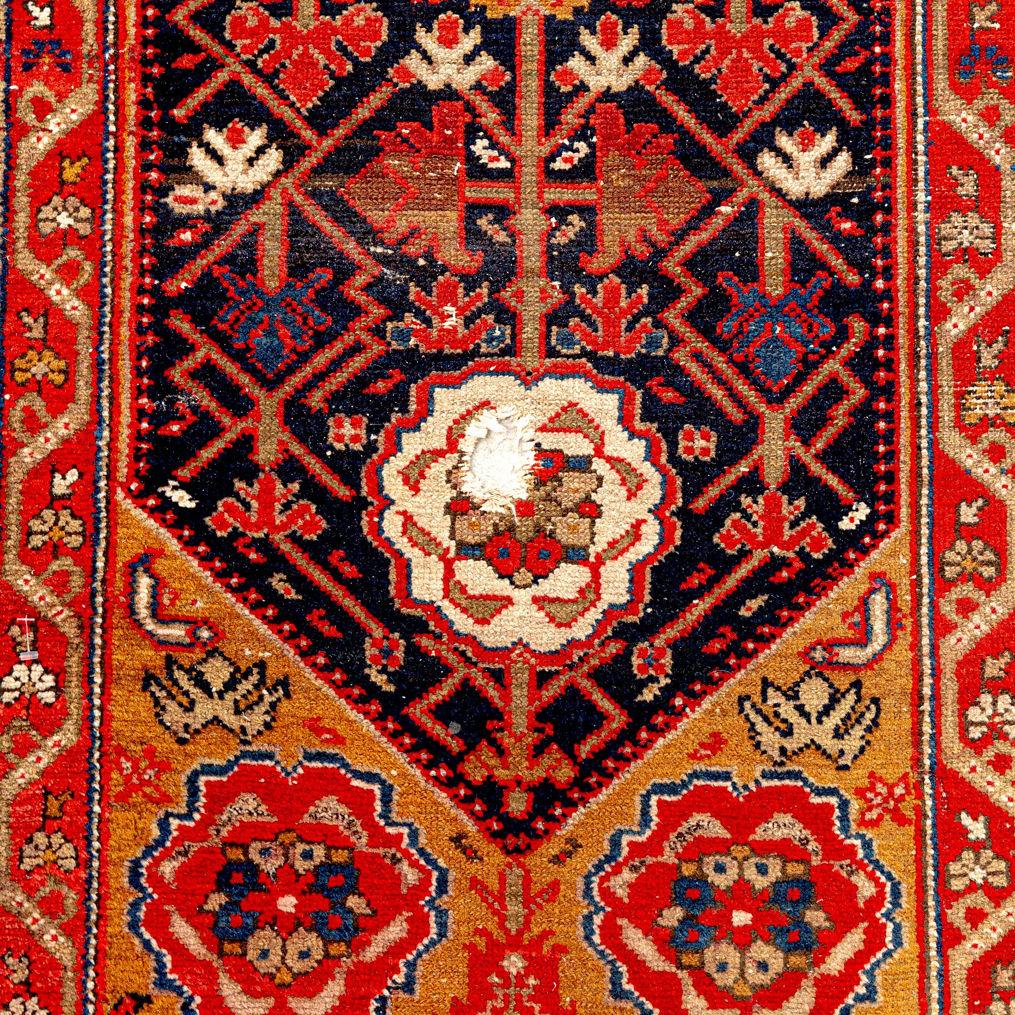 An antique Malajir runner ca 505x102 cm.
