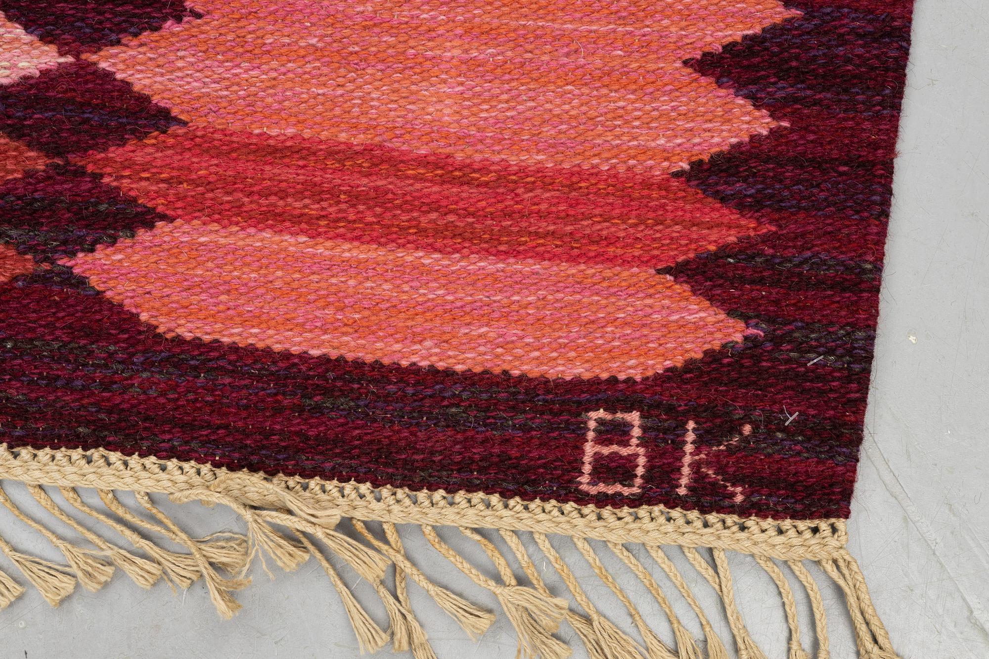 Berit Koenig , a carpet 'Viggen röd' flat weave, signed SH BK, ca 246 x 150 cm.