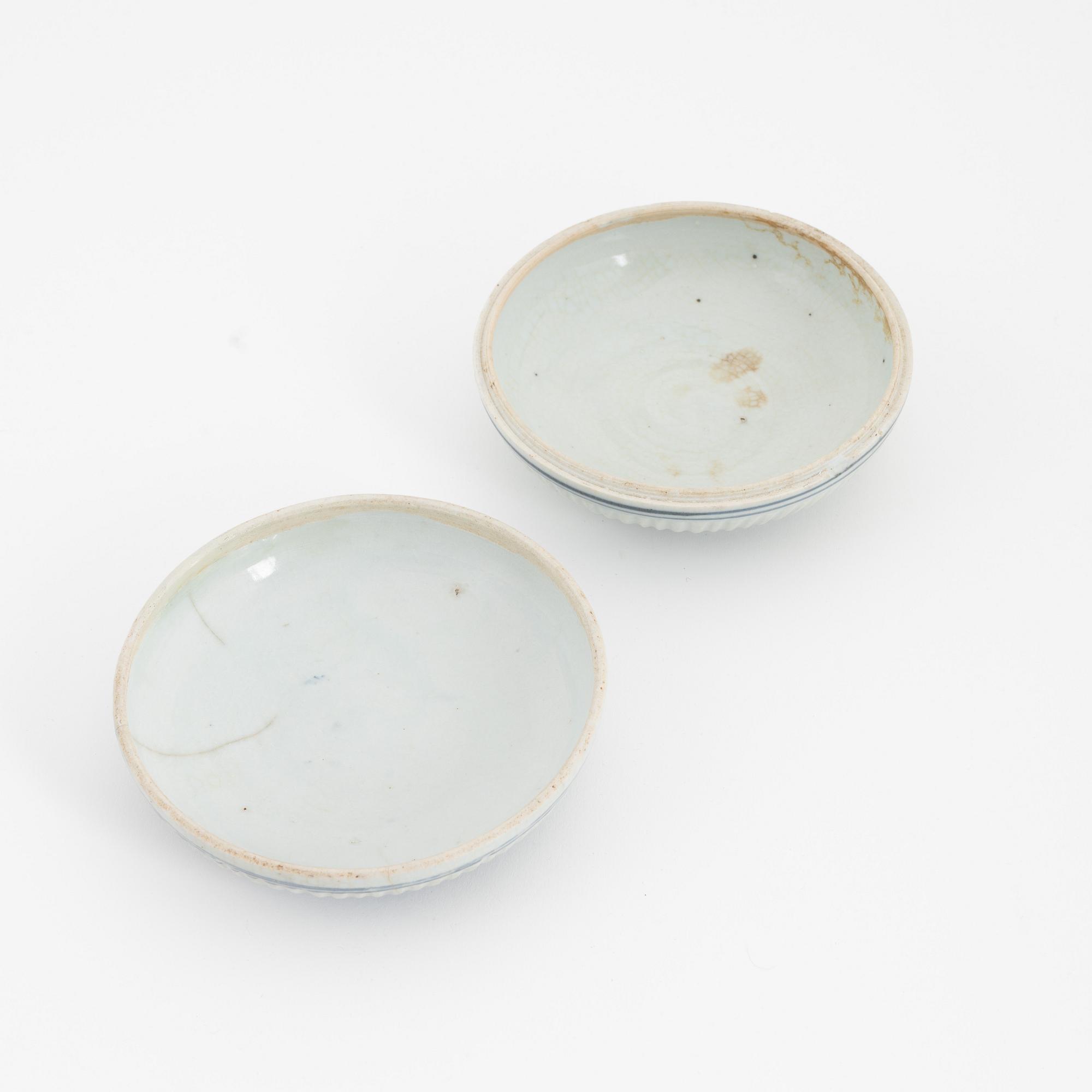 A Chinese blue and white box with cover, Ming dynasty, 17th century and three bowls, Southeast Asia, 19th/20th century.