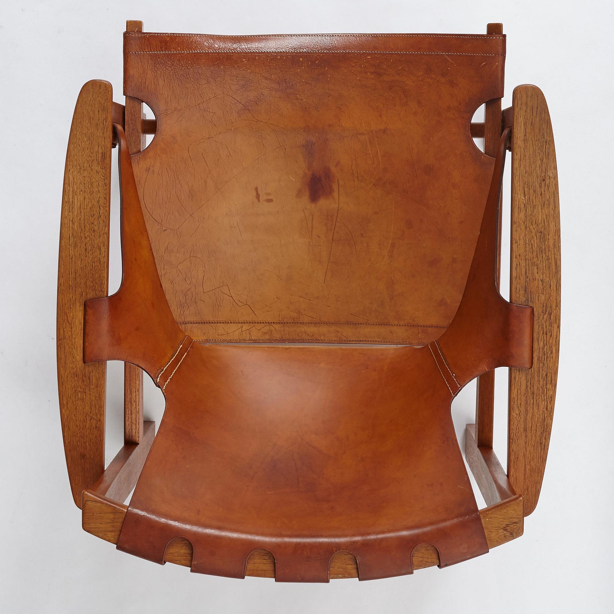 Carl-Axel Acking, a "Trienna" oak and natural leather easy chair, for Nordiska Kompaniet, Sweden 1960's.