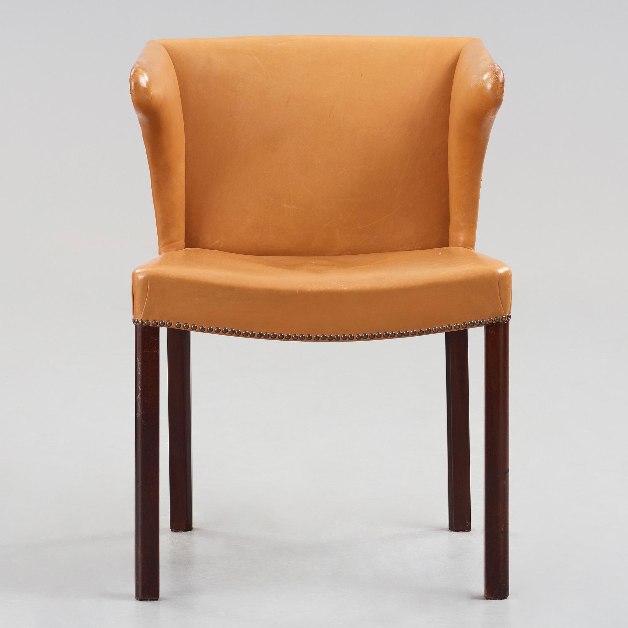 Frits Henningsen, a stained mahogany and brown leather armchair, Denmark.