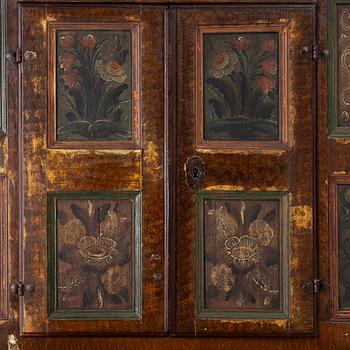 A corner cupboard, dated 1779.