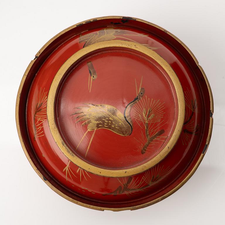 A group of nine Japanese lacquer bowls with covers, Meiji and 20th century.