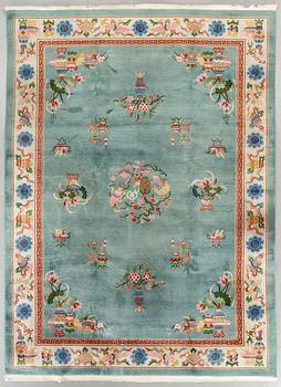 An old Chinese carpet ca 335 x 243 cm.