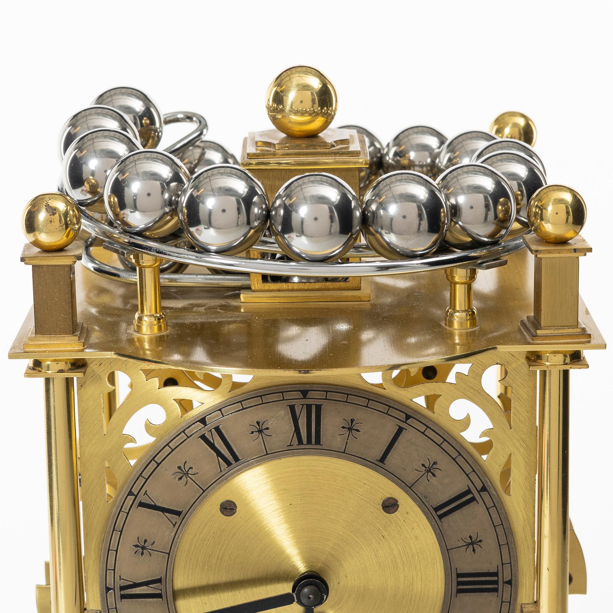 Bordsur, "Spherical weight clock", Dove Baxeley Cheltenham, England, 1900-talets slut.