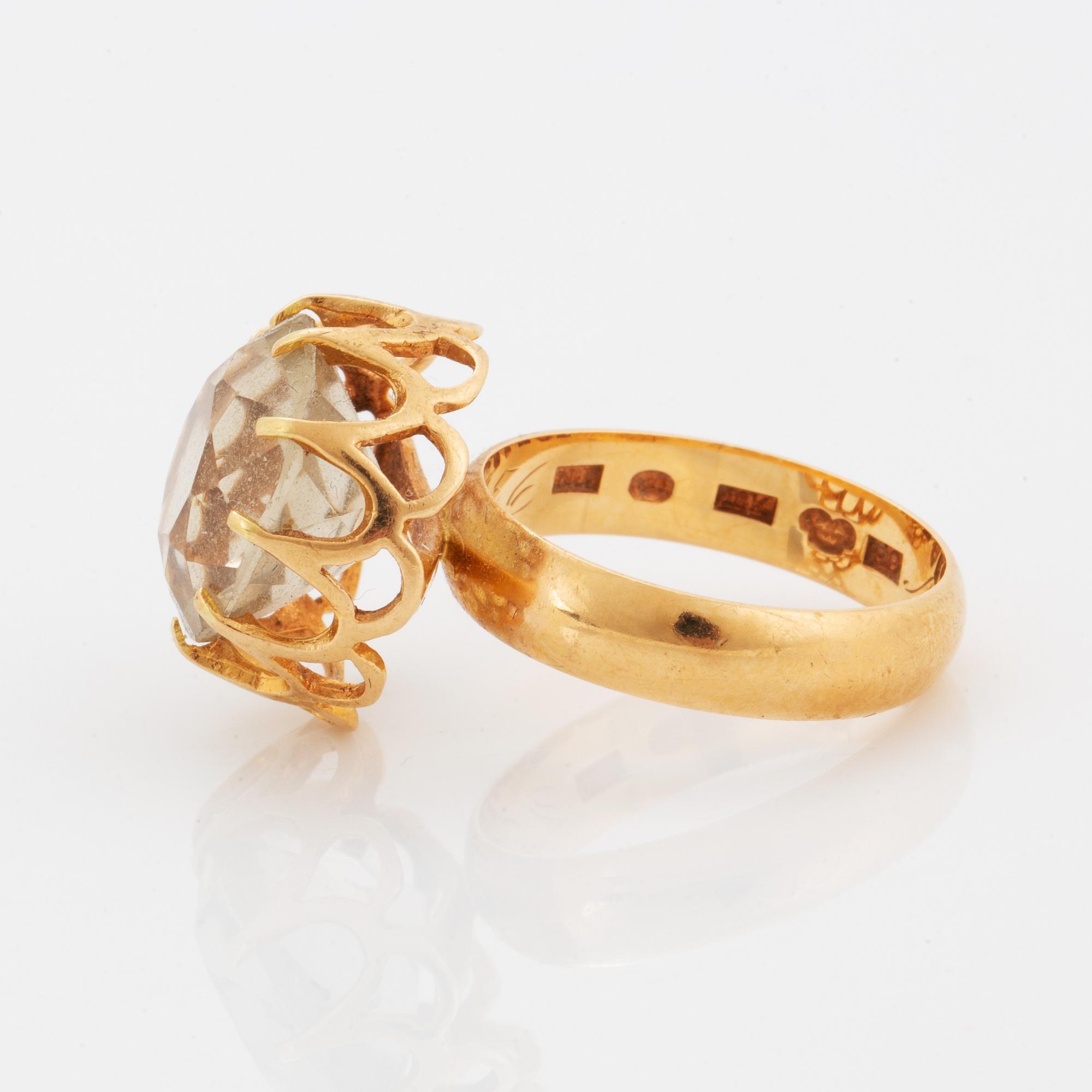 Ring, 18K guld med rund fasettslipad citrin.