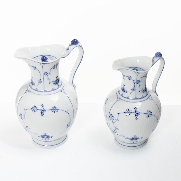 Royal Copenhagen, Three 'Musselmalet' jugs, circa 1900, and a Bing & Grøndahl cachepot, Denmark.