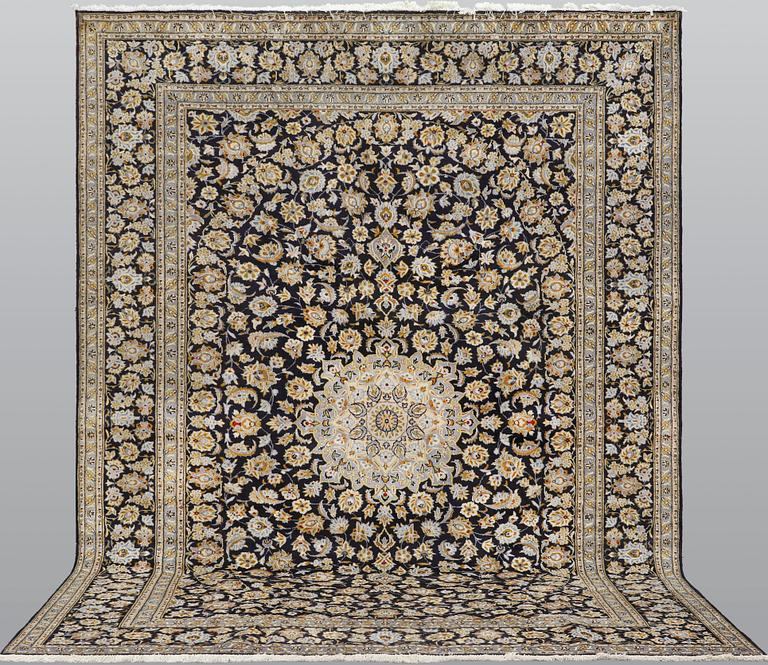 A carpet, Keshan approx. 410 x 310 cm.