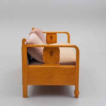 a sofa by NK Stockholm in the 1930's.