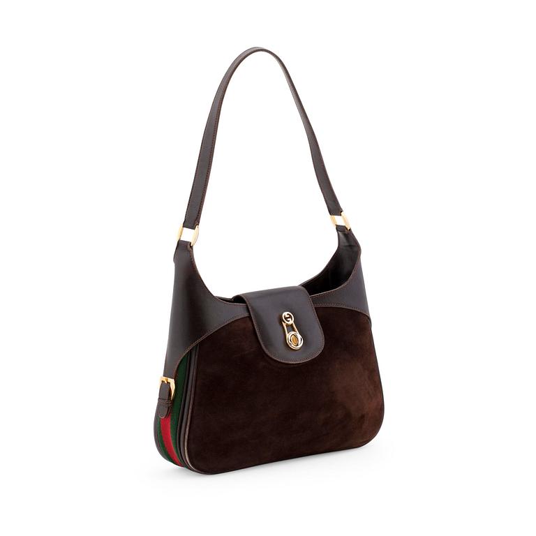 GUCCI, a brown suede and leather shoulder bag with stripes.