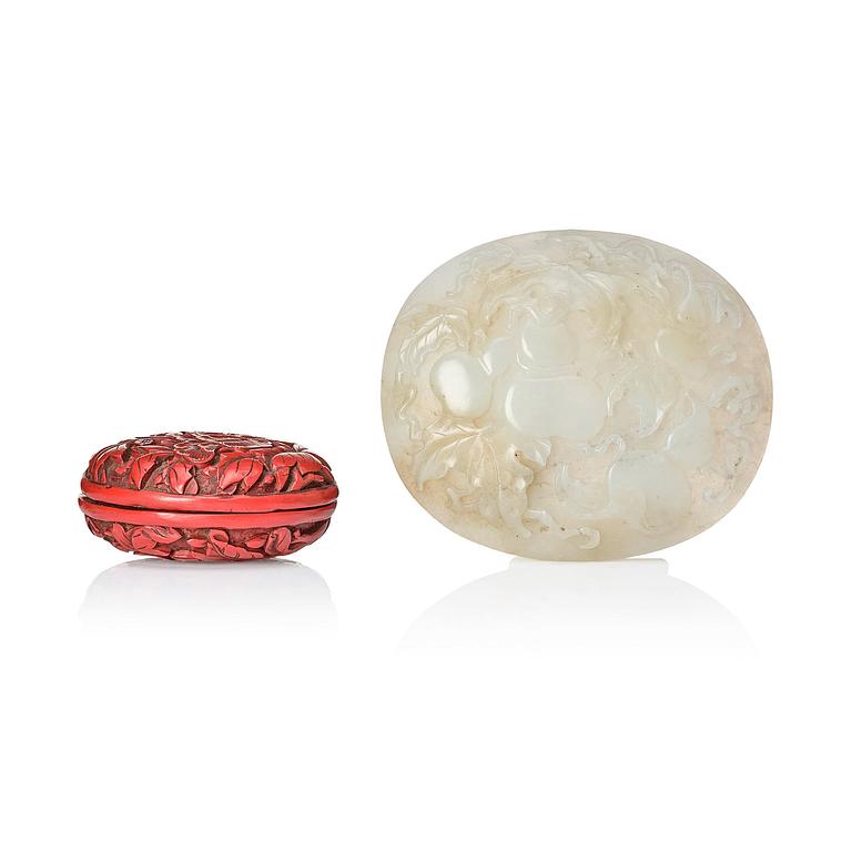 A Chinese red lacquer box with cover and a sculptured nephrite plaque, 20th Century.